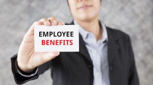 58034218 - businessman showing business card with word employee benefits
